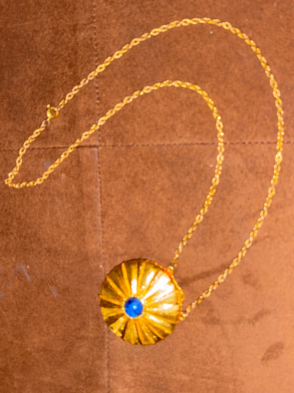 Vintage 1970s Gold-Tone Pendant Necklace with Blue Accent stone Estée Lauder